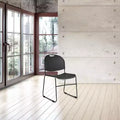 Lot de 2 chaises empilables ultra-compactes, noires, piètement luge, polypropylène